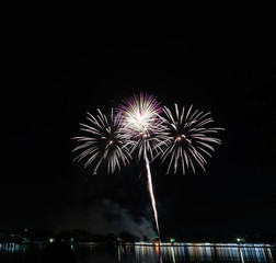 Beautiful colorful firework on the river