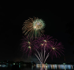 Beautiful colorful firework on the river