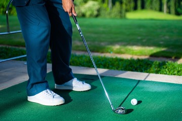 golfer ready to swing golf ball