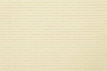 Old beige brick wall background texture