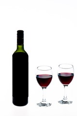 bottle and glass of red wine isolated on white background
