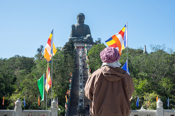 woman traveling with hat, Asian traveler visit the Tian Tan or Big Buddha located at Po Lin...