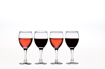 four glasses of red and pink wine