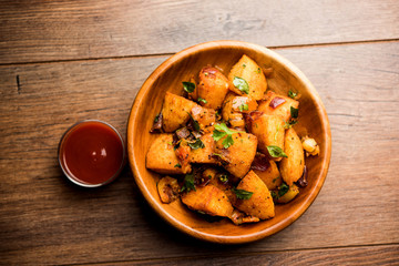 Masala fried Idlies or Idli fry - south indian Snack made using with leftover idly served with...