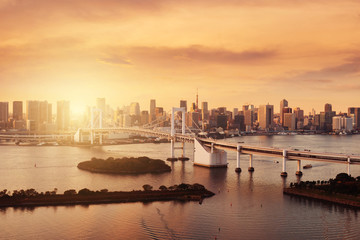 Naklejka premium Tokyo city skyline landmark view with warm tone sunset time for landmark travel background.