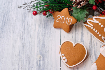 ginger biscuit on white background with Christmas tree.Copy space