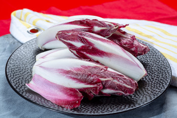 Group of fresh red Radicchio chicory or Belgian endive vegetables, also known as witlof salade