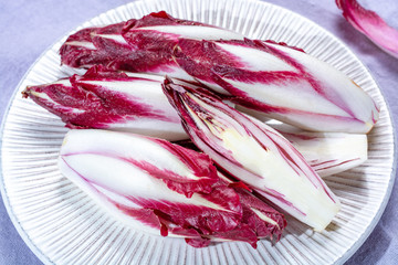 Group of fresh red Radicchio chicory or Belgian endive vegetables, also known as witlof salade