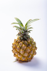 Fresh ripe pineapple or sweet baby ananas isolated close up
