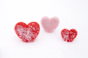 Obraz na płótnie Canvas hearts on the snow