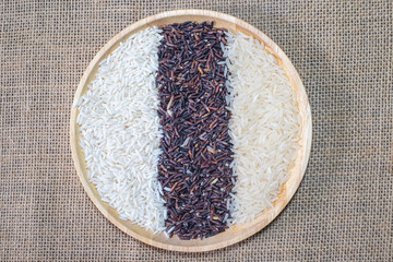 Organic, Healthy food, Mixed rice in wooden bowl on the sack background, topview