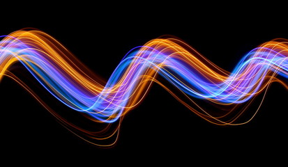 Light painting photography, blue and gold swirls of vibrant color, long exposure photo of fairy lights against a black background