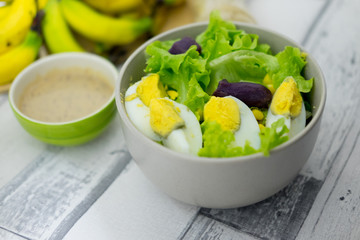 Fresh fruit and fresh vegetable salad with salad dressing