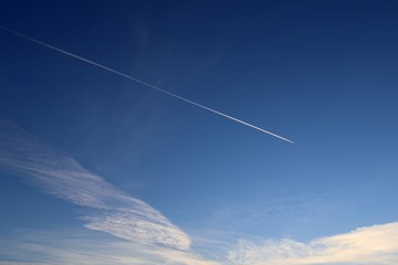 Aircraft contrails on a beautiful blue sky