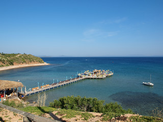 A jetty with bar leading out to sea in Altinkum Turkey