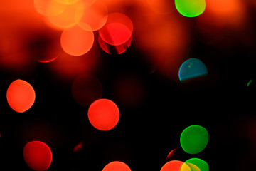 bokeh of blue, green and yellow on a black background