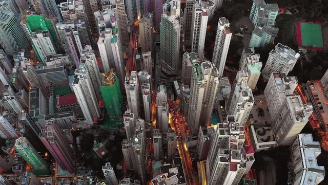 Fly above Urban city scene around victoria harbour central area in night light, Hong Kong , 4k high resolution video