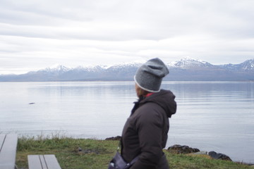 Fototapeta na wymiar Norway, fiord, tromso, Woman on the lake