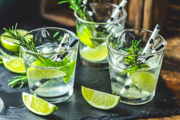 Fresh cocktail with lime, ice and rosemary, mojito cocktail