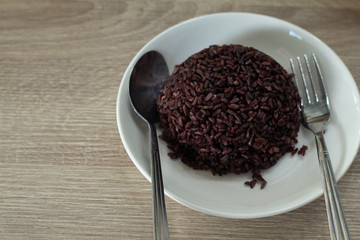 Purple  rice cooked on white dish ready for serve