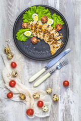 Chicken with honey and mustard souse, lettuce, quail eggs, cherry tomatoes