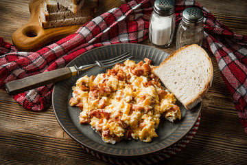 Scrambled eggs with sausage.