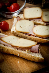 Fototapeta na wymiar Sandwich with ham and smoked cheese.