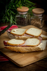 Sandwich with ham and smoked cheese.