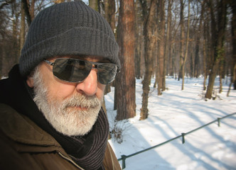 The man in the park in the snow, male model.