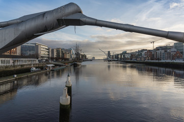 Fototapeta na wymiar View over the Liffey river towards the harbor of Dublin.