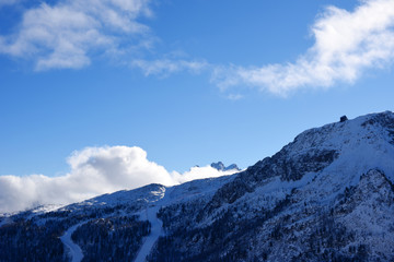 Fototapeta na wymiar Panoramically view from ski slope over Dolomite mountains in Tre Valli, Italy. - Image