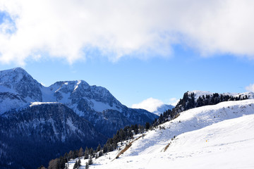 Panoramically view from ski slope over Dolomite mountains in Tre Valli, Italy. - Image