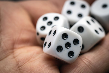 Dice in hand, macro.