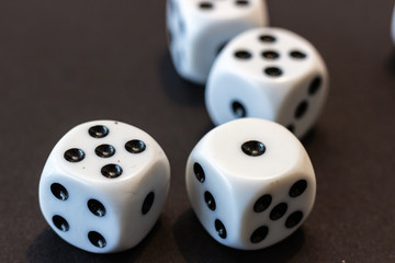 Dice for game on a black background.