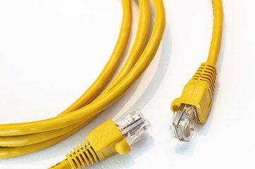 Yellow network connector isolated on white background.