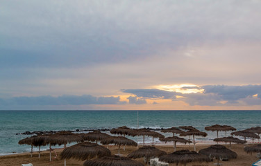 Sunset beach with umbrella landscape