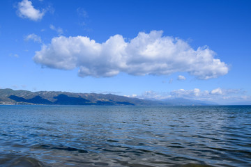 Landscape of Ohrid lake with mountain background. Pogradec, Tushemisht, Albania.