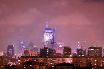 Fototapeta na wymiar Downtown city at night. New Year's Eve fireworks
