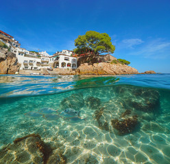 Spain picturesque village and fish underwater