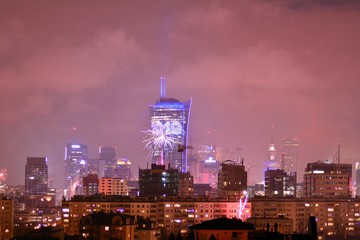 Fototapeta na wymiar Downtown city at night. New Year's Eve fireworks