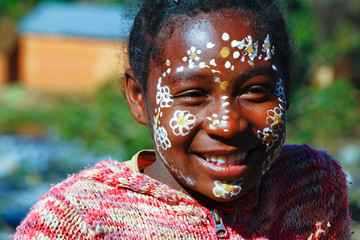 Girl with traditionally painted face, Madagascar