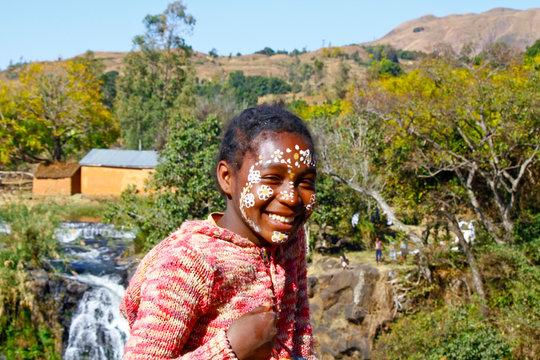 Girl with traditionally painted face, Madagascar