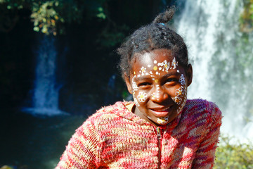 Girl with traditionally painted face, Madagascar