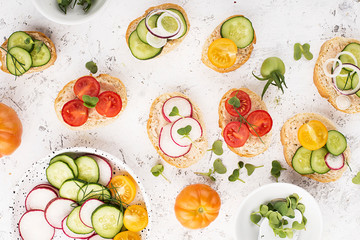 Vegetable mini toast farmer market assorted white baguette vegetables with fish riyette decorated with mini green daikon. Top View