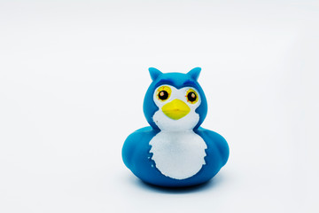 A colorful blue penguin rubber duck isolated on a white background