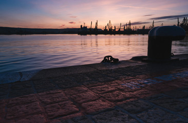 Autumn sunset at the sea station with ships.