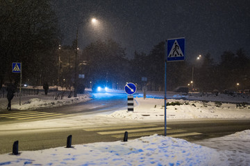 Pedestrian crossing at night in winter.