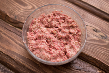 Fresh minced meat with bread for making meatballs.