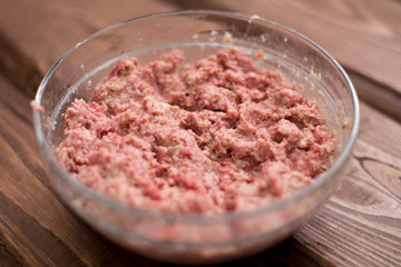 Fresh minced meat with bread for making meatballs.