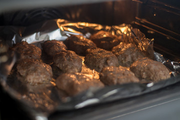 Roasting meat cutlets in the oven.